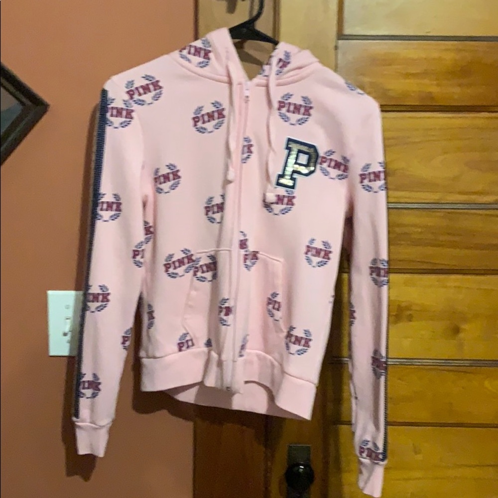 Pink zip up sweatshirt.